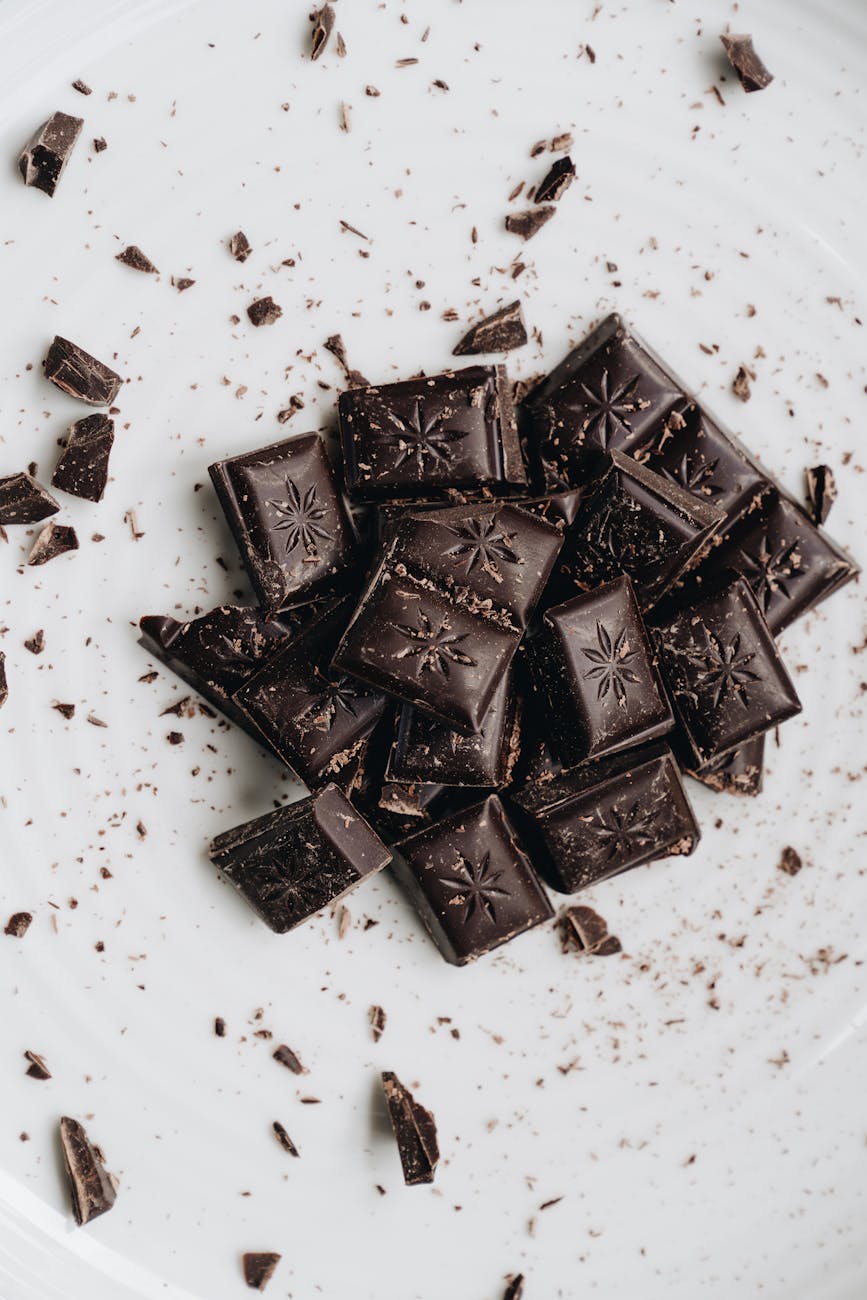 close up shot of dark chocolates on a white surface