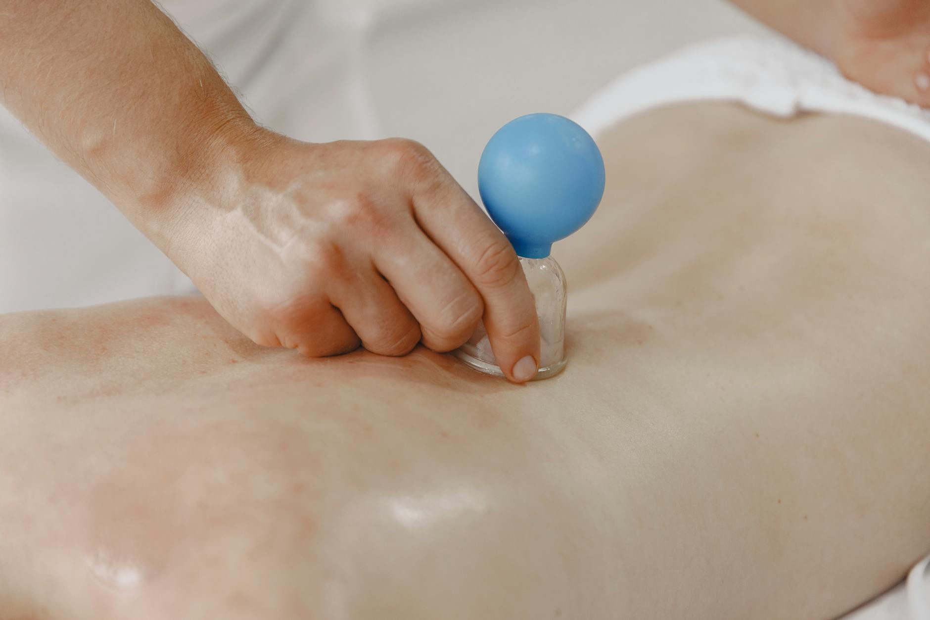 person using a medical vacuum suction cup